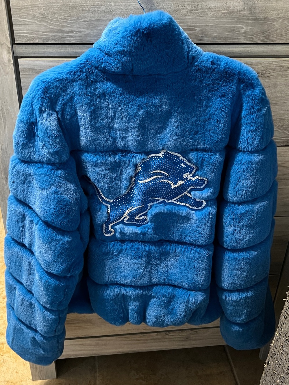 Women’s Blue Faux-Fur Puffer Jacket with Embroidered Lion Logo on front & back